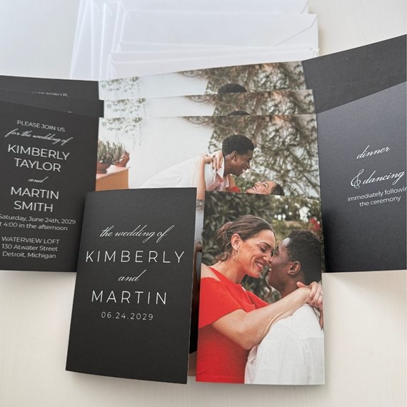 black wedding invitation with photo area and white text